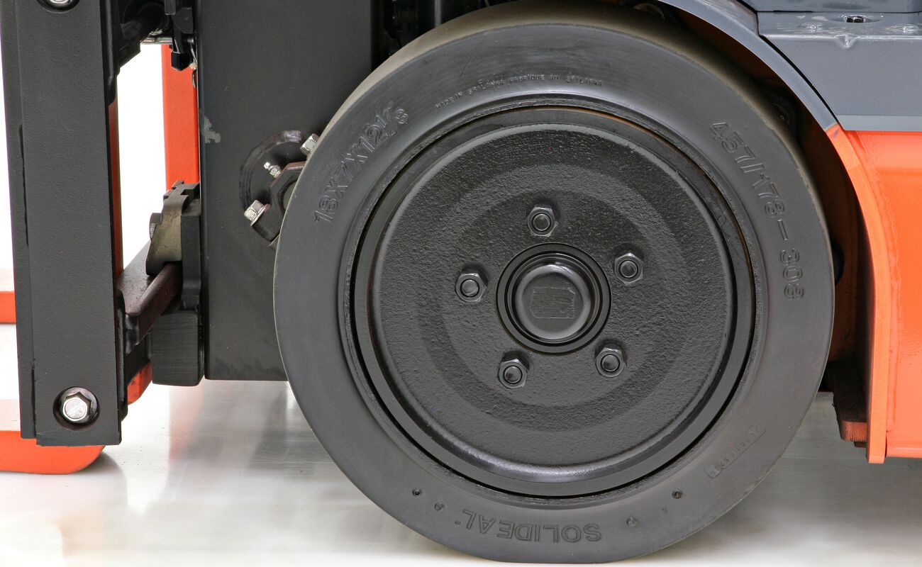 Close-up image of a forklift tire and wheel.